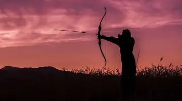 Shoowing a bow at sunset