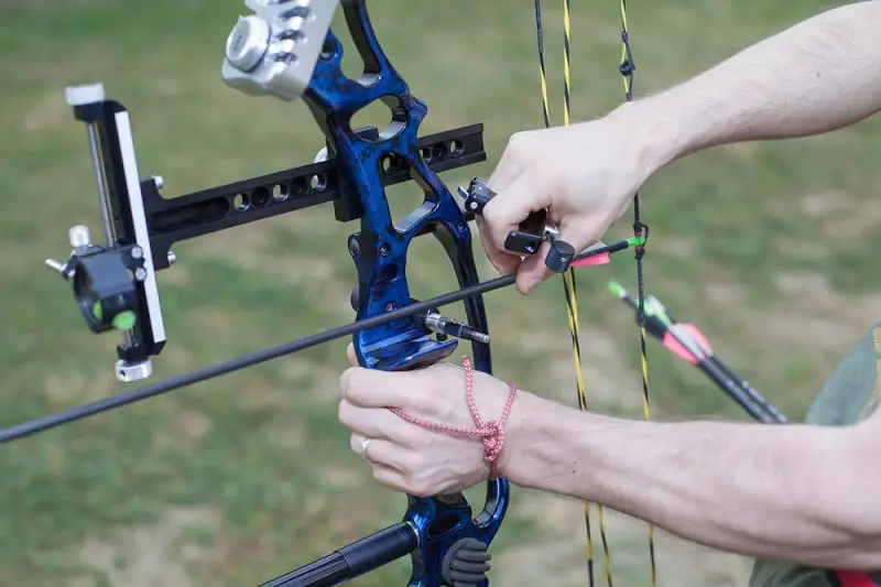Putting Arrow On Compound Bow