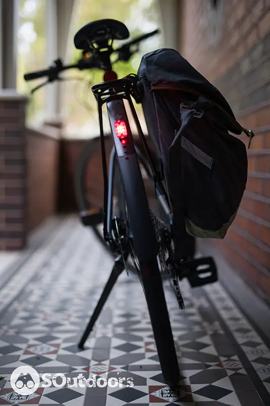 Red signal light on the back of a black e-bike