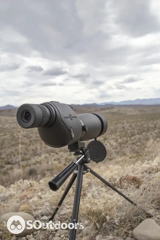 Spotting scope mounted on a low level tripod
