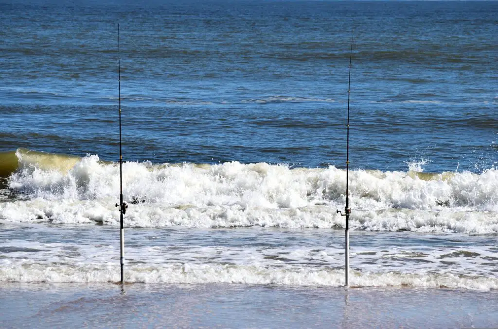 Two fishing rods mounted on the seashore