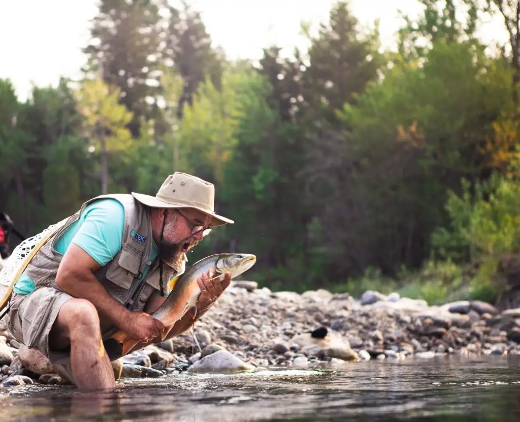 A fisherman catching trout without fly fishing